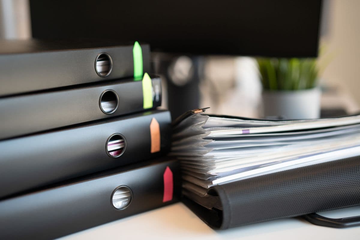 Household documents organised in a folder — keeping these details accessible to everyone in the home